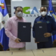 Foto 1 El Director De La DGA Eduardo Sanz Lovaton Y Carlos R. Febrillet Director General Del Cuerpo Especializado En Seguridad Aeroportuario Y De La Aviacion Civil CESAC.