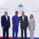 Presidente Luis Abinader Gloria Reyes Y El Director General De Conape Jose Garcia Ramirez Junto A Uno De Los Hombres Que Recibieron La Certificacion Oficial Como Persona Cuidadora
