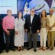 La Presidenta De Adompretur Junto A Los Expositores Y Pasados Presidentes De La Entidad